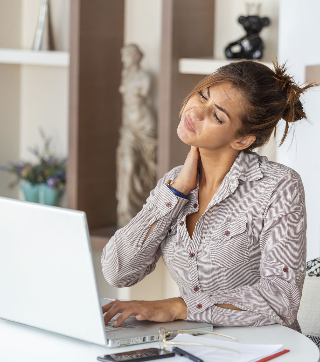 young-businesswoman-suffering-from-neckache-massaging-her-neck-while-sitting-her-working-place-home-office_r1_c1